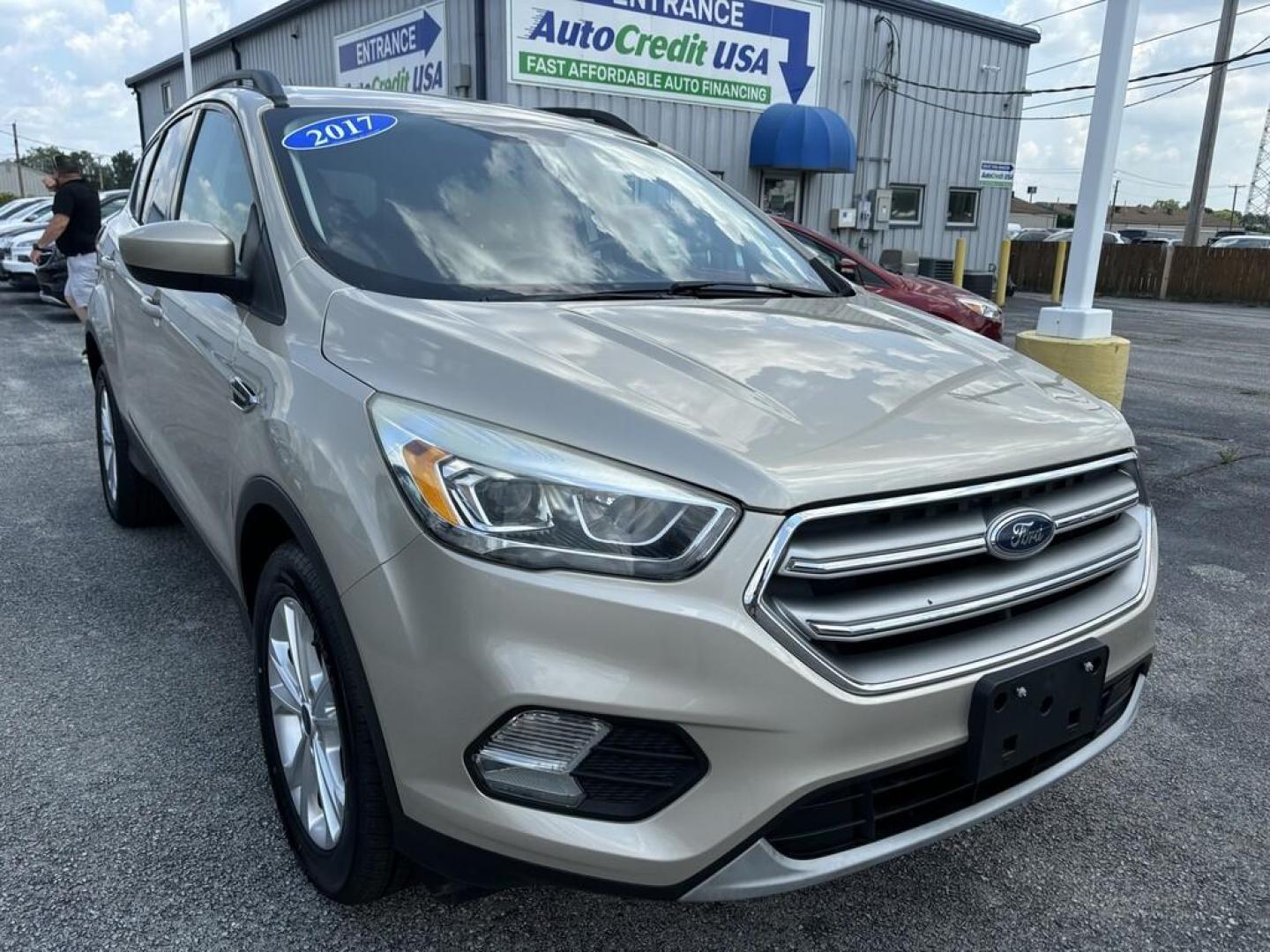 2017 GOLD FORD ESCAPE SE (1FMCU0GD4HU) , located at 100 West Coliseum Boulevard, Fort Wayne, IN, 46805, (260) 471-0567, 41.118340, -85.141014 - Photo#0