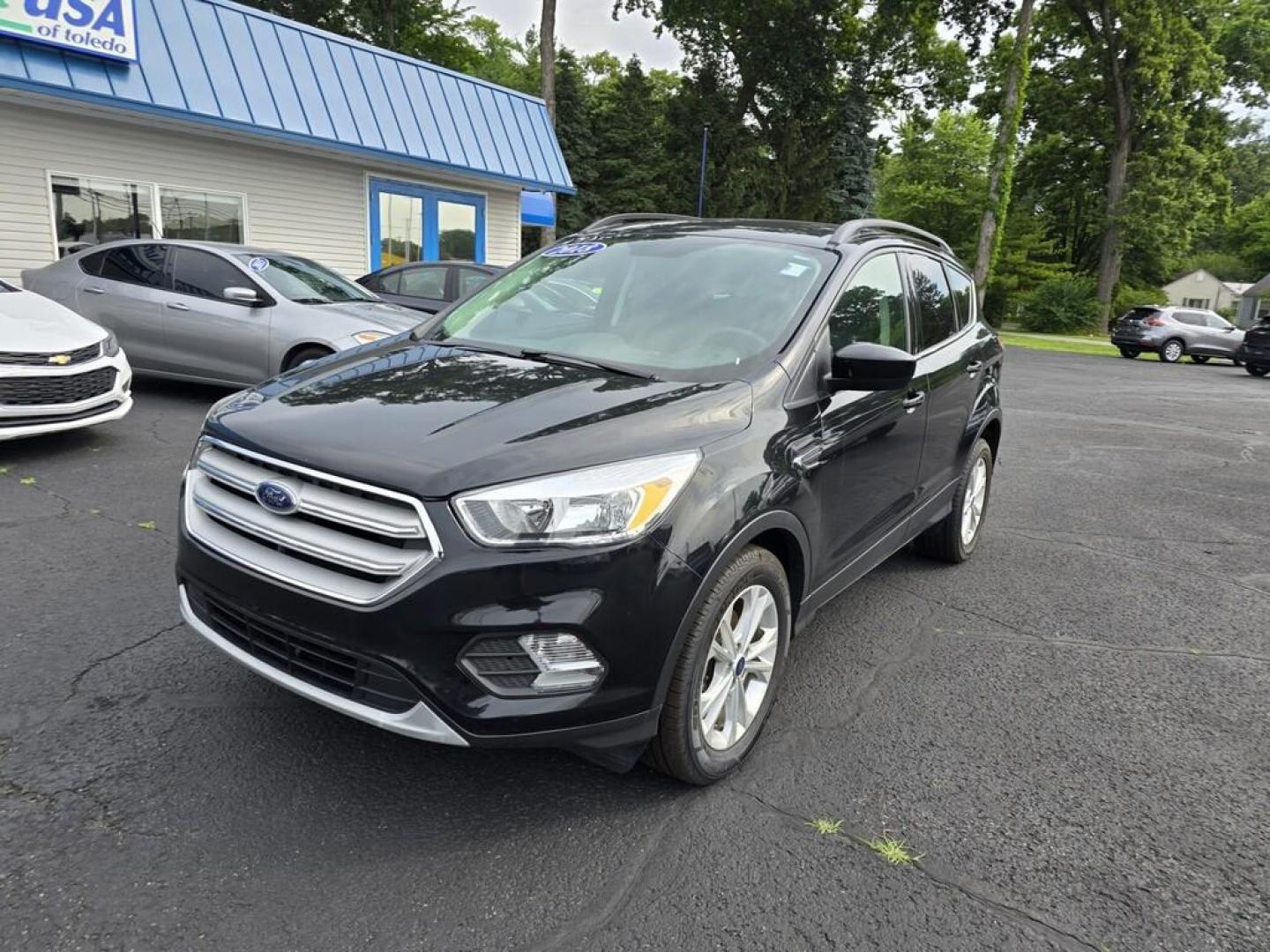 2018 BLACK FORD ESCAPE SE (1FMCU0GDXJU) , located at 5744 Central Avenue, Toledo, OH, 43615, (419) 724-0130, 41.676781, -83.682137 - Photo#1