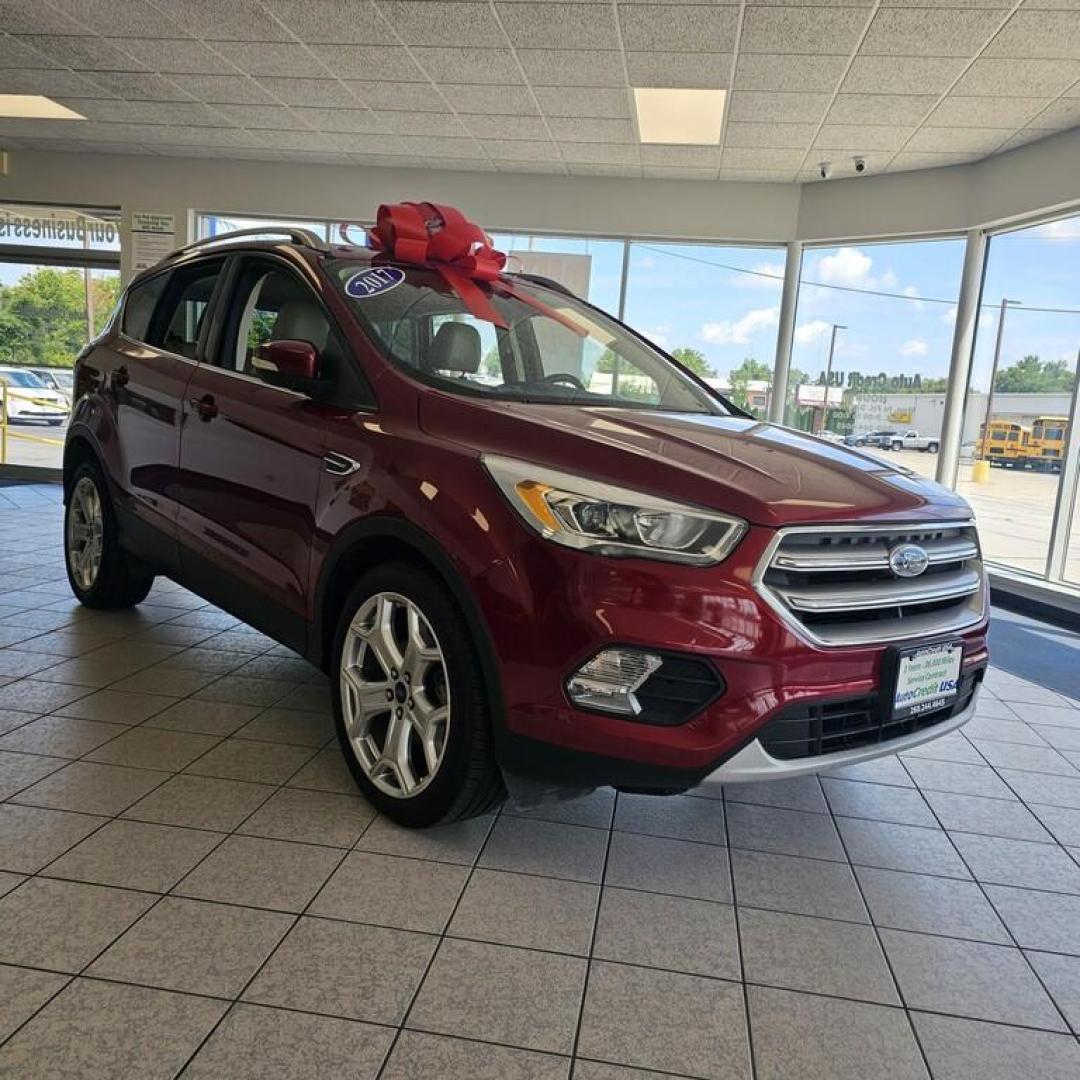 2017 MAROON FORD ESCAPE TITANIUM (1FMCU0JD4HU) , located at 502 South Main Street, Columbia City, IN, 46725, (260) 244-4645, 41.151382, -85.490578 - Photo#0