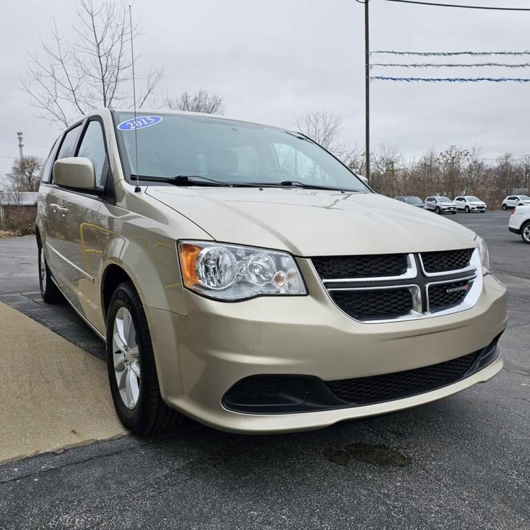 2015 GOLD DODGE GRAND CARAVAN SXT SXT (2C4RDGCG9FR) with an 3.6L V-6 engine, 6 speed AT transmission, located at 502 South Main Street, Columbia City, IN, 46725, (260) 244-4645, 41.151382, -85.490578 - Photo#1